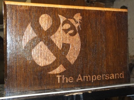 "The Ampersand" is the Diocese of Camden Life and Justice Ministry. Made from the end of an abandoned Holy Name pew.