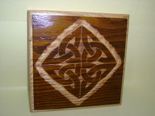 A four cornered Celtic knot design carved on Holy Name Pew. $35-